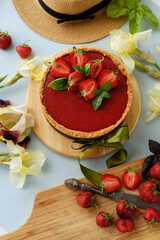 Cold cheesecake with strawberry jelly.