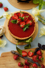 Cold cheesecake with strawberry jelly.