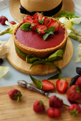 Cold cheesecake with strawberry jelly.