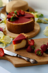 Cold cheesecake with strawberry jelly.