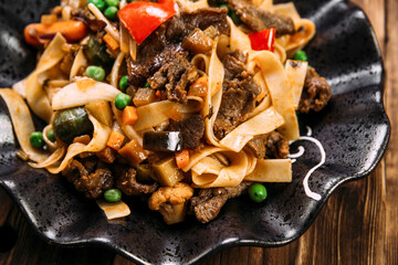 Asian style pasta tagliatelle beef and vegetables