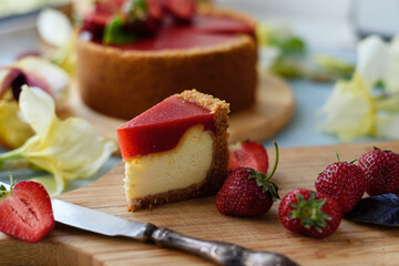 Cold cheesecake with strawberry jelly.