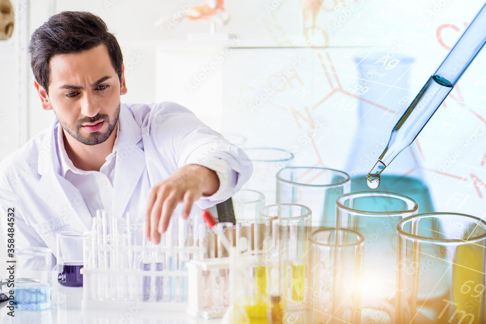 Wall mural caucasian scientist man lab technical service observe liquid sample with lab glassware and test tube