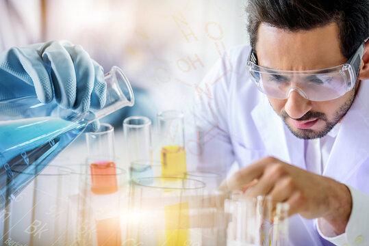 Caucasian scientist man lab technical service observe liquid sample with lab glassware and test tubes in chemical laboratory background, science laboratory research and lab development concept