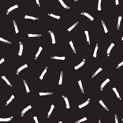 Vector seamless hand-drawn pattern with white brush strokes on the black background. Grunge style. 