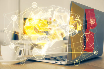 Double exposure of work space with computer and human brain drawing hologram. Brainstorm concept.