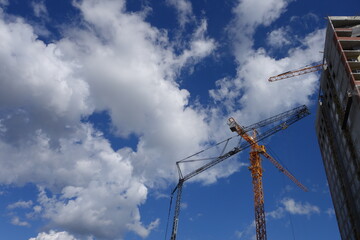 a construction crane near a house under construction
