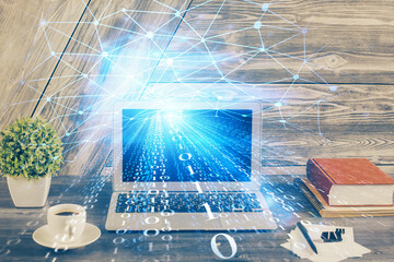 Double exposure of desktop computer and technology theme hologram. Concept of software development.