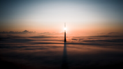 sunset in clouds with TV tower 