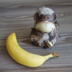 Toy monkey and yellow banana