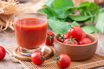 Tomato juice. Tomato juice on wooden background.