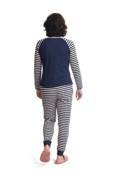 Rear View Of A Woman In Pajamas Walking On White Background,