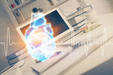 Desktop computer background and heart drawing. Double exposure. Medical study and healthcare concept.