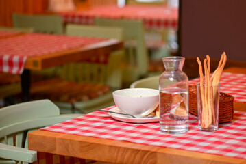Okroshka. Summer light cold yogurt soup with cucumber, radish, eggs and dill in a bowl. Dinner in restaurant.