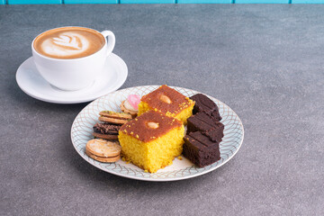 Sfouf, cookies and brownies dessert with cappuccino