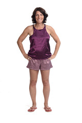 Naklejka premium front view of summer short pajamas on white background, hands on waist