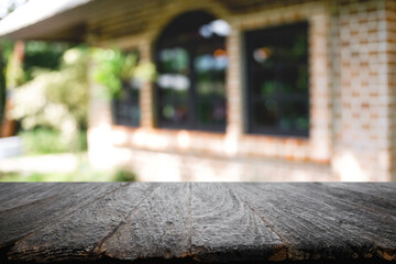Blurred background of home garden picnic and wooden table free space for product display.