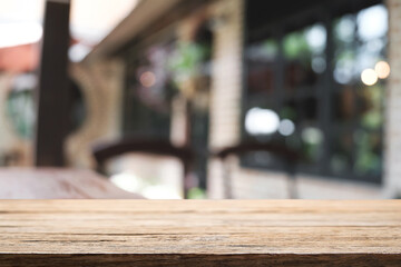 Blurred background of home garden picnic and wooden table free space for product display.