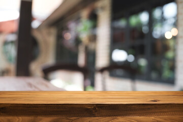 Blurred background of home garden picnic and wooden table free space for product display.