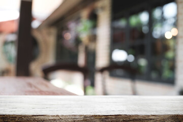 Blurred background of home garden picnic and wooden table free space for product display.