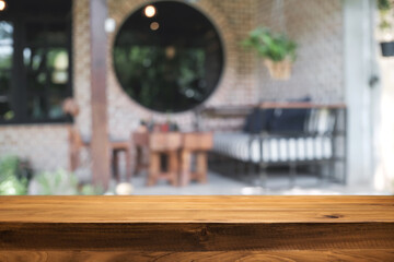 Blurred background of home garden picnic and wooden table free space for product display.