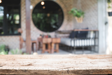 Blurred background of home garden picnic and wooden table free space for product display.