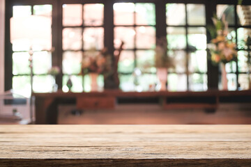 Empty wooden desk space platform and blurred restaurant or coffee shop background for product display montage.