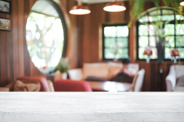 Empty wooden table space platform and blurred restaurant or coffee shop background for product display montage.