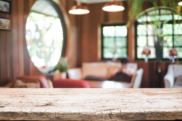 Empty wooden table space platform and blurred restaurant or coffee shop background for product display montage.