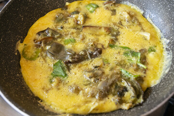 preparing frittata with onions and basil