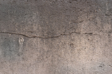 Stone wall with cracks and plaster texture. Grunge White plaster wall Background