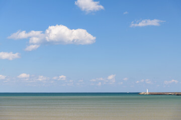 Blue skies and clouds over the blue sea