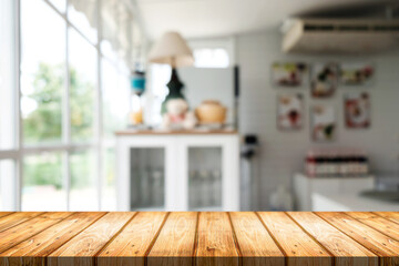 Empty wooden table space platform and blurred restaurant or coffee shop background for product display montage.