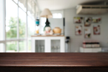 Empty wooden table space platform and blurred restaurant or coffee shop background for product display montage.