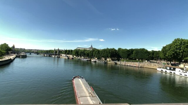 Timelapse River Seine in Paris France with boat activity. Grand Palais, Pont de la Concorde