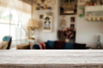 Wooden desk space platform and blurred restaurant or coffee shop background for product display montage.