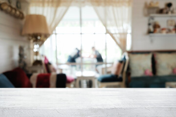 Empty wooden table space platform and blurred restaurant or coffee shop background for product display montage.