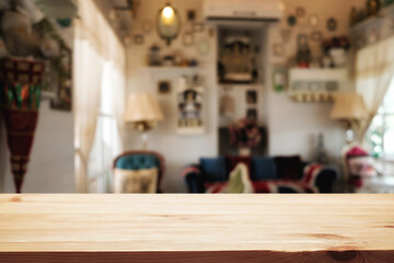 Wooden table space platform and blurred restaurant or coffee shop background for product display montage.