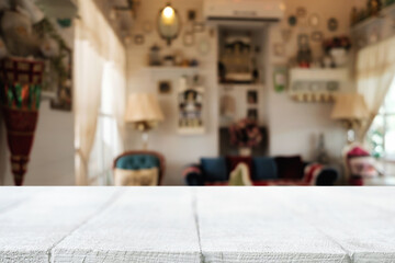 Wooden table space platform and blurred restaurant or coffee shop background for product display montage.