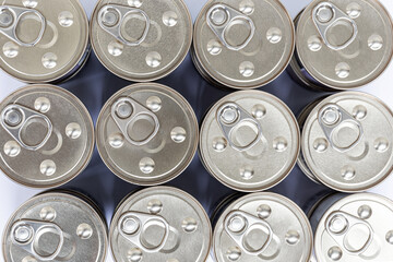 Top view on rows of metal cans with keys. Close-up.