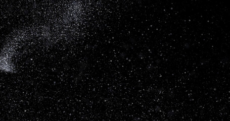 abstract Flying dust particles on a black background