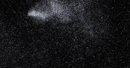 abstract Flying dust particles on a black background