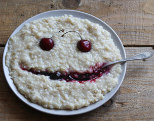oatmeal porridge on a wooden table close up
