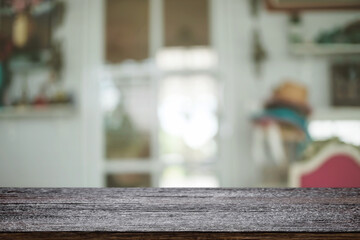 Empty wooden table space platform and blurred restaurant or coffee shop background for product display montage.