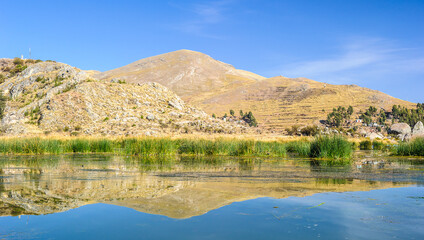 Fototapeta na wymiar Panorama of the mountains ana the lake Titicaca in Peru
