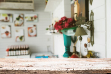 Empty wooden table space platform and blurred restaurant or coffee shop background for product display montage.