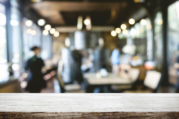 Empty wooden table space platform and blurred restaurant or coffee shop background for product display montage.