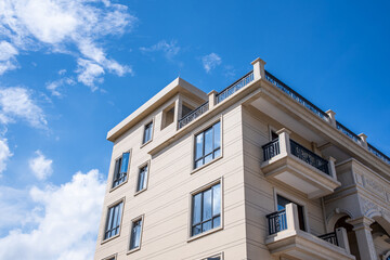 A newly built light steel villa under the blue sky and white clouds