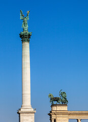 Fototapeta na wymiar Statue of Archangel Gabriel on top of a column on Heroes' square, Budapest