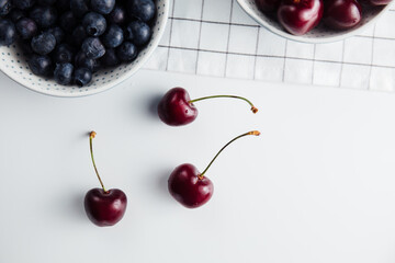 Close-up of cherries and blueberries on a wooden Board. Fresh berries